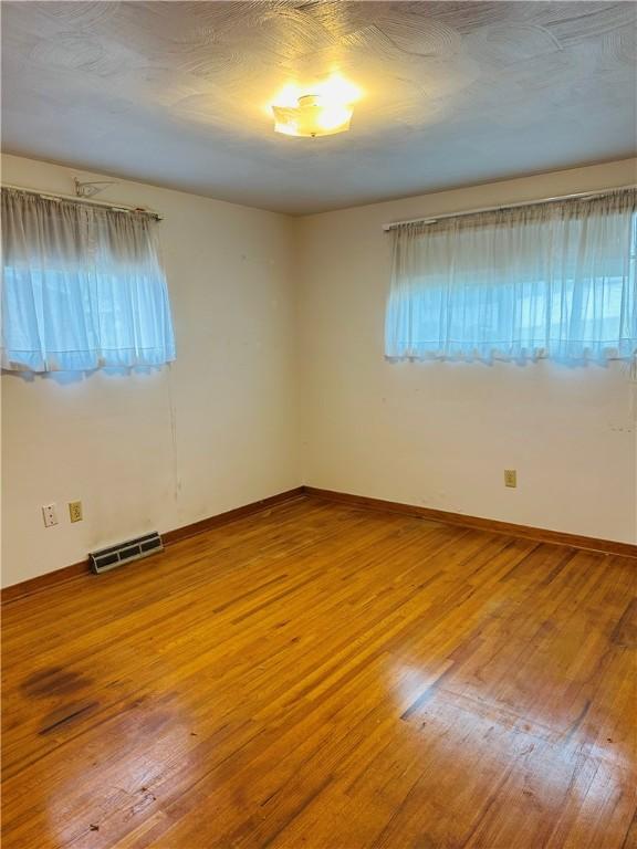 1026 Jefferson Ave, Jeannette, PA 15644 - unfurnished room featuring wood finished floors and baseboards