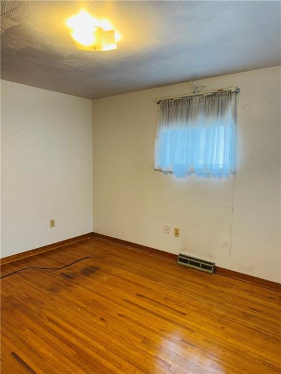 1026 Jefferson Ave, Jeannette, PA 15644 - spare room featuring hardwood / wood-style flooring and baseboards