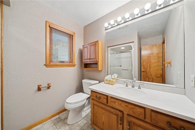 490 Hillside Ave, Monroeville, PA 15146 - bathroom with baseboards, vanity, toilet, a shower with shower door, and a textured wall