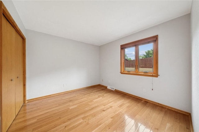 490 Hillside Ave, Monroeville, PA 15146 - unfurnished bedroom featuring light wood-style floors, a closet, and baseboards