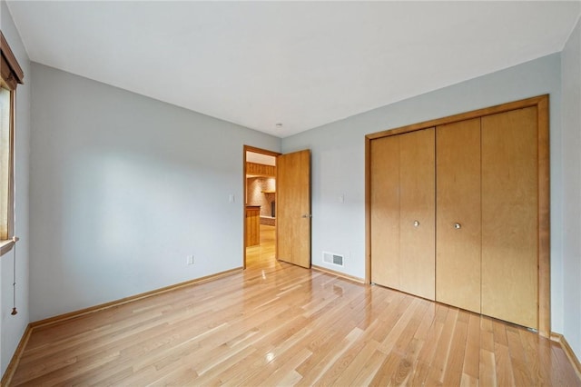 490 Hillside Ave, Monroeville, PA 15146 - unfurnished bedroom with light wood finished floors, a closet, and baseboards