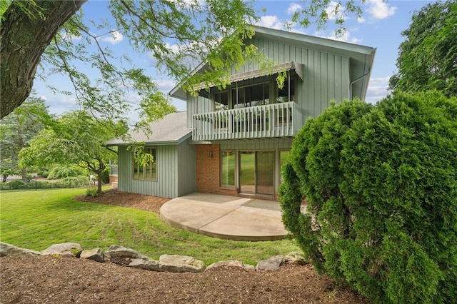490 Hillside Ave, Monroeville, PA 15146 - back of house featuring a patio, a lawn, a balcony, and board and batten siding