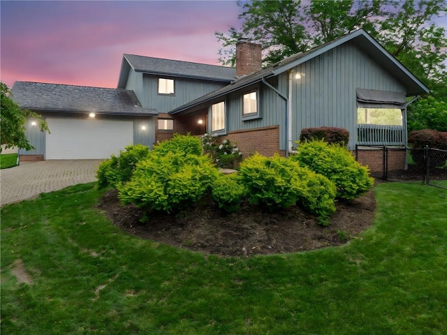 490 Hillside Ave, Monroeville, PA 15146 - view of front of home with a garage, a chimney, driveway, and brick siding