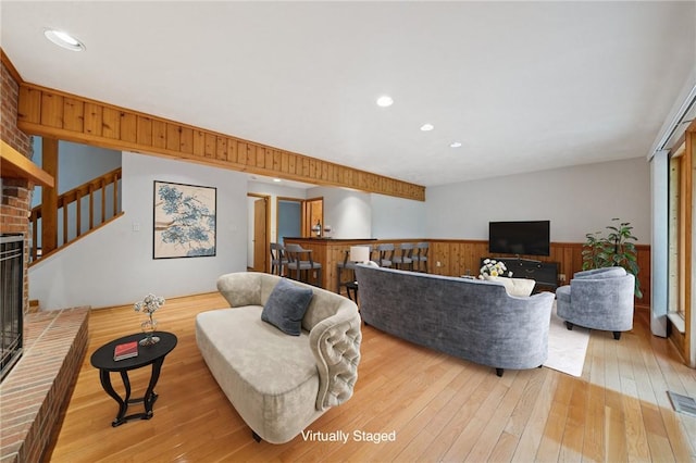 490 Hillside Ave, Monroeville, PA 15146 - living room with a wainscoted wall, hardwood / wood-style flooring, stairs, wood walls, and recessed lighting