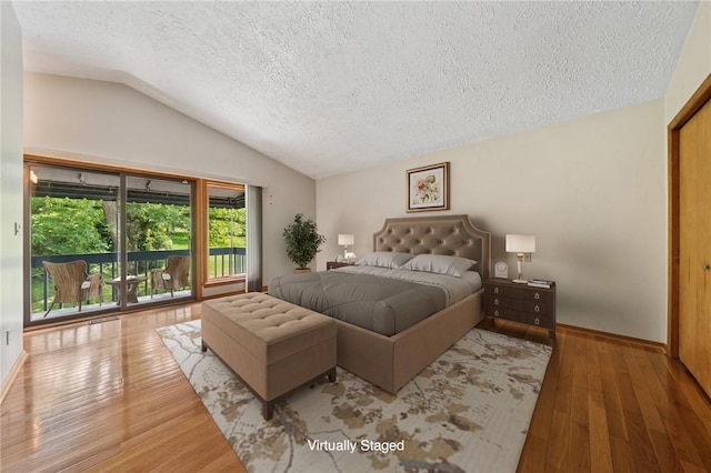 490 Hillside Ave, Monroeville, PA 15146 - bedroom with vaulted ceiling, a textured ceiling, wood finished floors, and baseboards