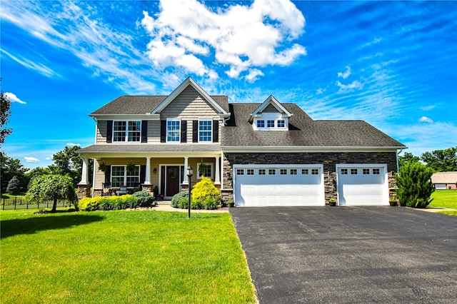 2000 Plantation Dr, Clinton Twp, PA 16056 - view of front facade featuring driveway, stone siding, an attached garage, a porch, and a front yard