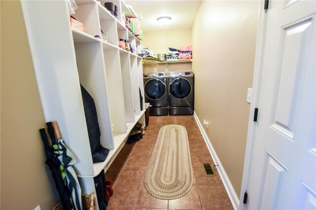 2000 Plantation Dr, Clinton Twp, PA 16056 - laundry room with washing machine and dryer, tile patterned flooring, and baseboards