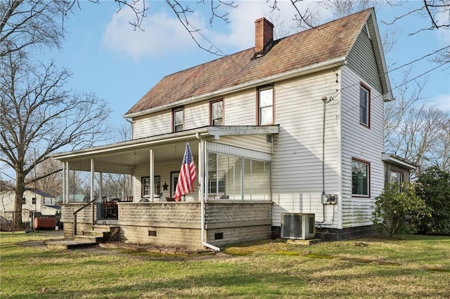 4553 Marr Rd, Pulaski Twp Law, PA 16143 - back of property with a porch, central AC unit, a chimney, a lawn, and a shingled roof
