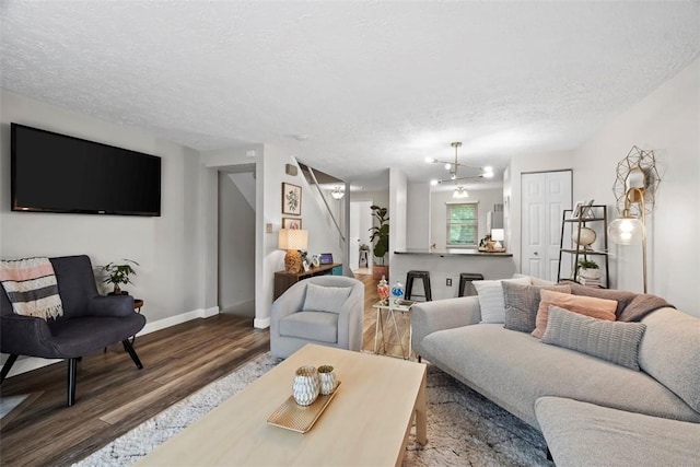 113 Stoney Creek Ct, Seven Fields Boro, PA 16046 - living room with wood finished floors, a textured ceiling, and baseboards