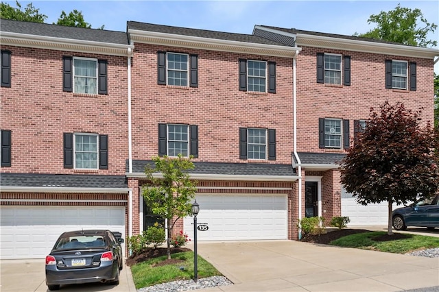 135 Lenox Dr, Findlay Twp, PA 15126 - view of property with concrete driveway, an attached garage, and brick siding
