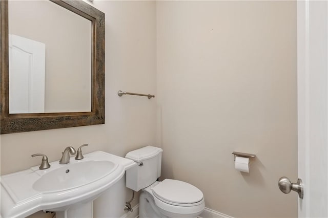 135 Lenox Dr, Findlay Twp, PA 15126 - bathroom with baseboards, toilet, and a sink