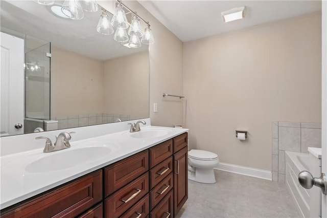 135 Lenox Dr, Findlay Twp, PA 15126 - full bathroom featuring a garden tub, double vanity, toilet, baseboards, and tile patterned floors