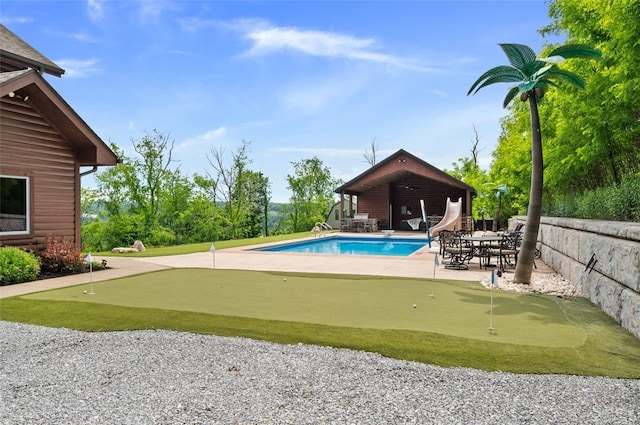 201 Roosevelt Rd, Kilbuck Twp, PA 15202 - view of swimming pool featuring an area to practice putting, a water slide, and a patio area