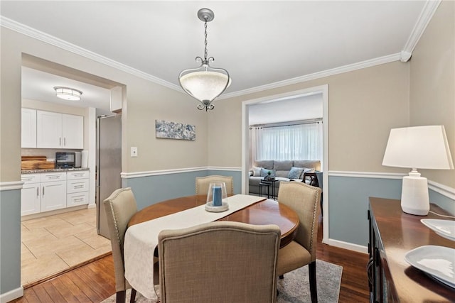 724 Pine Valley Dr, Plum Boro, PA 15239 - dining area with ornamental molding and light wood finished floors