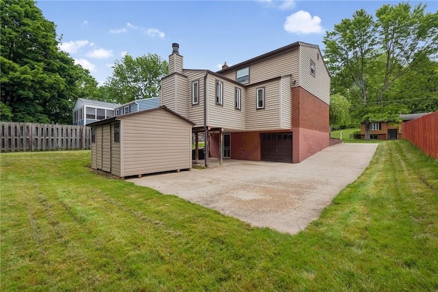 724 Pine Valley Dr, Plum Boro, PA 15239 - rear view of house with a chimney and concrete driveway