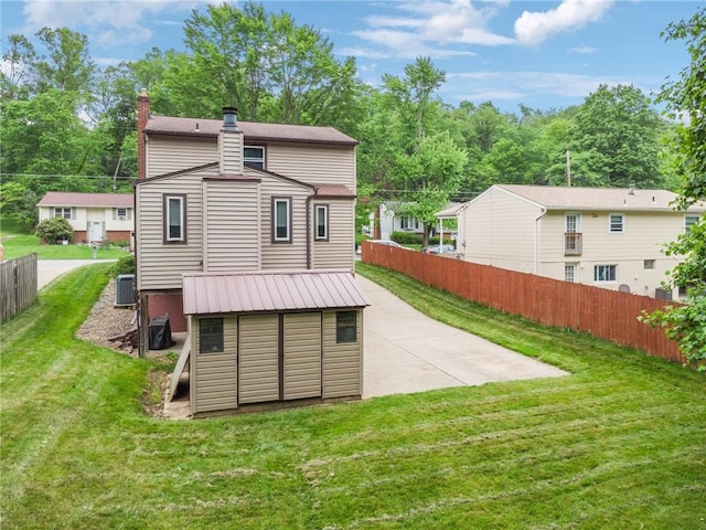 724 Pine Valley Dr, Plum Boro, PA 15239 - back of property featuring a chimney, cooling unit, and a patio