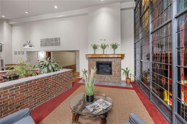 5 Bayard Rd Unit 808, Shadyside, PA 15213 - living area with recessed lighting, a tiled fireplace, baseboards, and a towering ceiling