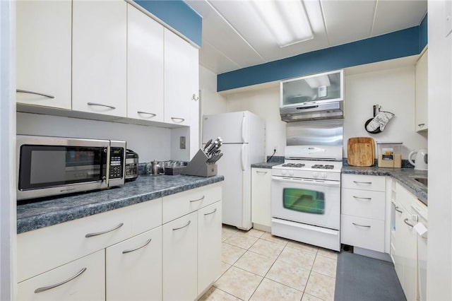 5 Bayard Rd Unit 808, Shadyside, PA 15213 - kitchen with white appliances, white cabinets, dark countertops, and under cabinet range hood