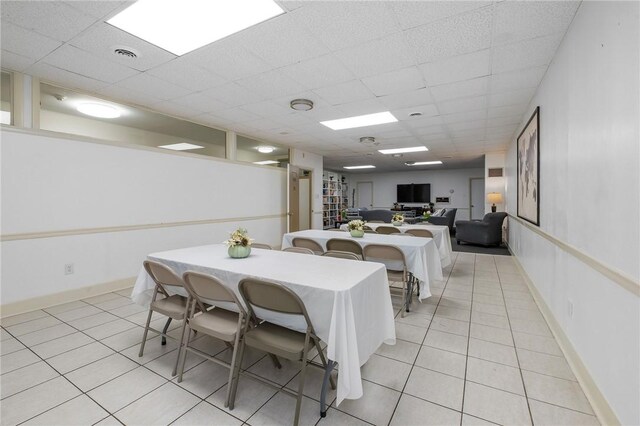 5 Bayard Rd Unit 808, Shadyside, PA 15213 - dining room featuring light tile patterned flooring, a drop ceiling, and baseboards