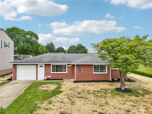 207 Martin Ave, Ellport Borough, PA 16117 - single story home with concrete driveway, a garage, brick siding, and a shingled roof