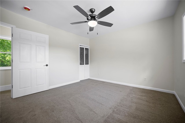 470 Burrell Hill Cir, Penn Twp Wml, PA 15675 - unfurnished bedroom featuring dark colored carpet, baseboards, ceiling fan, and a closet