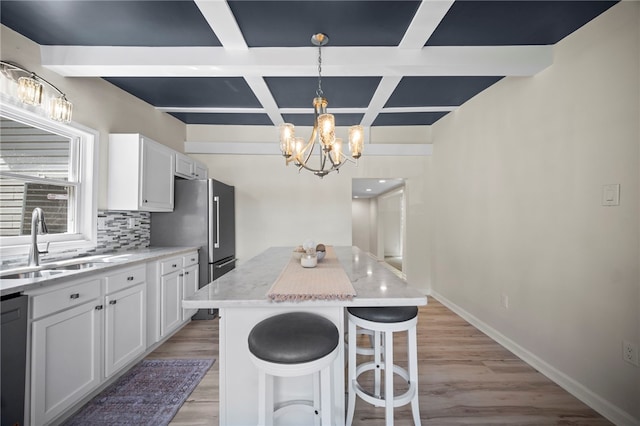 470 Burrell Hill Cir, Penn Twp Wml, PA 15675 - kitchen with coffered ceiling, a sink, a kitchen island, a chandelier, and backsplash