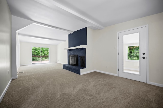 470 Burrell Hill Cir, Penn Twp Wml, PA 15675 - unfurnished living room with carpet flooring, a brick fireplace, beam ceiling, and baseboards