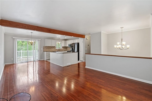 116 Buttercup Dr, Cranberry Twp, PA 16066 - unfurnished living room featuring a chandelier, baseboards, dark wood-style floors, and crown molding