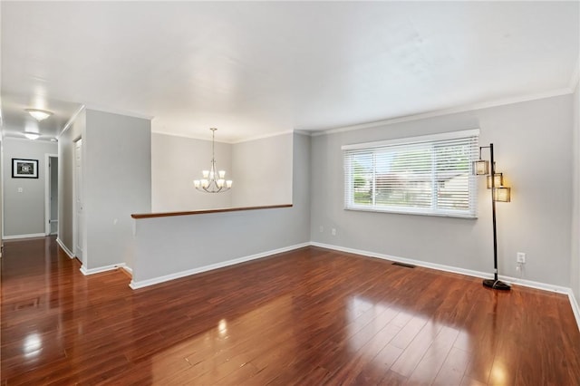 116 Buttercup Dr, Cranberry Twp, PA 16066 - spare room featuring crown molding, a chandelier, wood finished floors, and baseboards