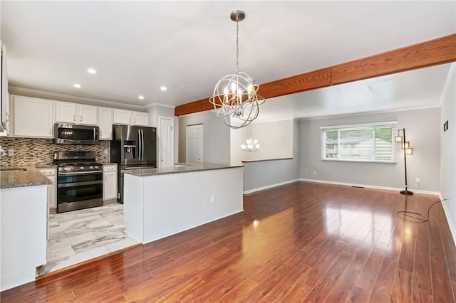 116 Buttercup Dr, Cranberry Twp, PA 16066 - kitchen with stainless steel appliances, a chandelier, a kitchen island, white cabinetry, and dark stone countertops