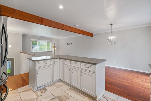 116 Buttercup Dr, Cranberry Twp, PA 16066 - kitchen with freestanding refrigerator, stone counters, crown molding, a kitchen island, and pendant lighting