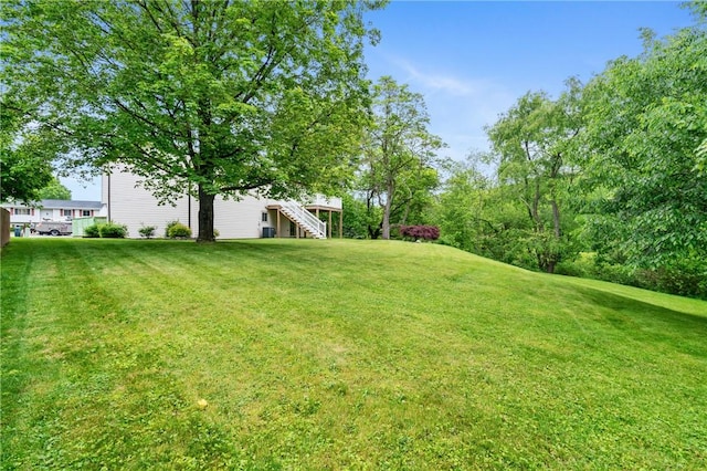 116 Buttercup Dr, Cranberry Twp, PA 16066 - view of green lawn with stairway and a deck