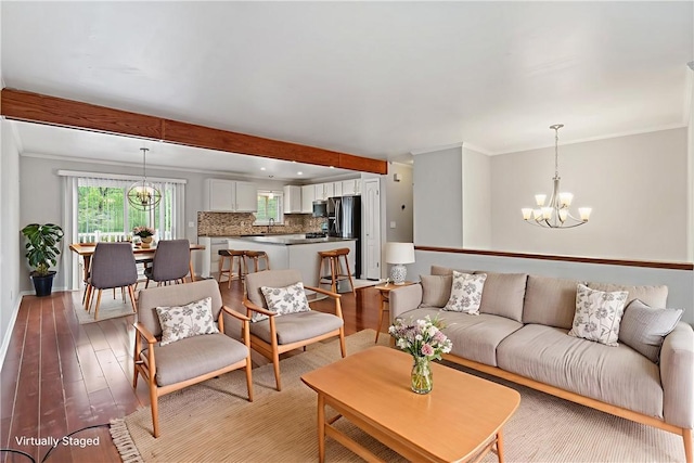 116 Buttercup Dr, Cranberry Twp, PA 16066 - living area with a chandelier, light wood-style flooring, crown molding, and baseboards