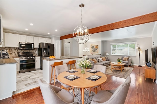 116 Buttercup Dr, Cranberry Twp, PA 16066 - dining area with a chandelier, crown molding, light wood finished floors, and recessed lighting