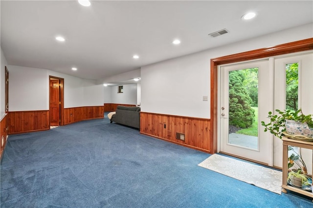 5010 W Grove Ln, Pine Twp Nal, PA 15044 - carpeted living room featuring a wainscoted wall, wooden walls, and recessed lighting