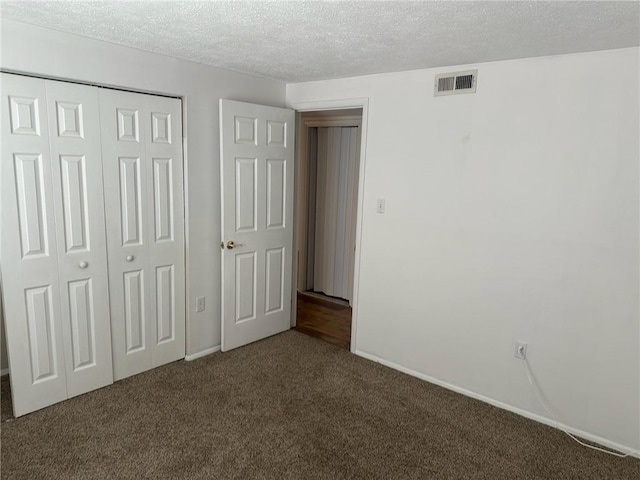 9015 James Ct Unit 9015, Hopewell Twp Bea, PA 15001 - unfurnished bedroom featuring carpet flooring, a closet, a textured ceiling, and baseboards
