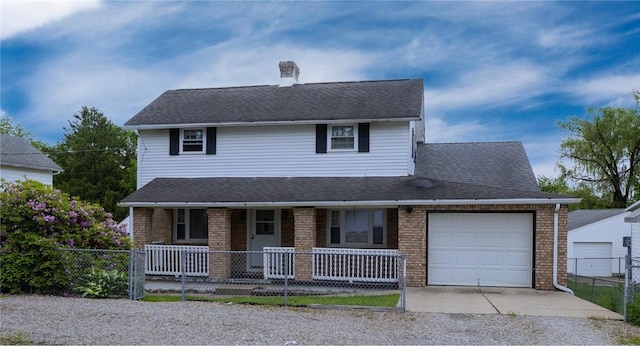 10 N St, Smith, PA 15004 - view of front of property with a porch, an attached garage, concrete driveway, and brick siding