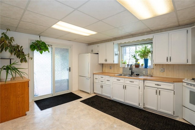10 N St, Smith, PA 15004 - kitchen featuring a sink, white appliances, white cabinetry, light countertops, and a drop ceiling