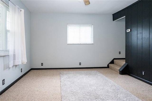 10 N St, Smith, PA 15004 - empty room featuring carpet flooring, stairs, and baseboards