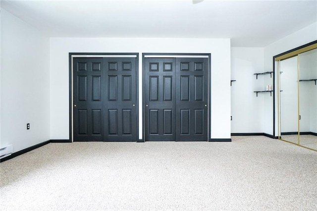 10 N St, Smith, PA 15004 - unfurnished bedroom featuring carpet flooring, two closets, and baseboards