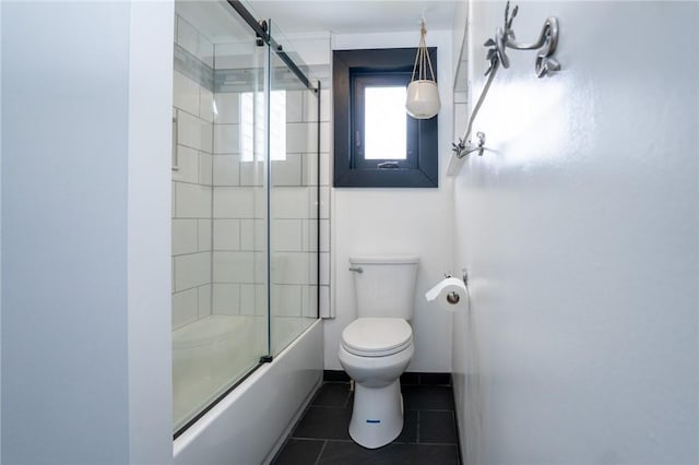 10 N St, Smith, PA 15004 - bathroom featuring toilet, shower / bath combination with glass door, and tile patterned flooring