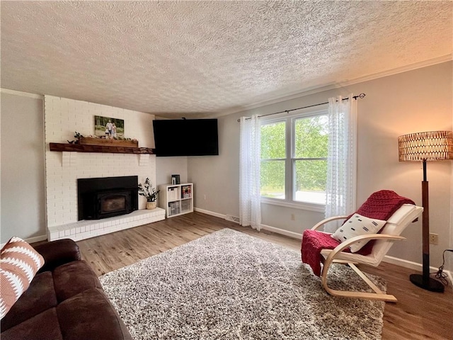 145 Marylee Dr, Brighton Twp, PA 15009 - living room with wood finished floors, a textured ceiling, baseboards, and ornamental molding