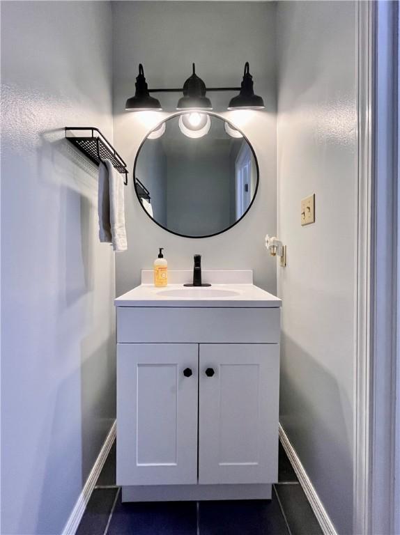 145 Marylee Dr, Brighton Twp, PA 15009 - bathroom with tile patterned flooring, vanity, and baseboards