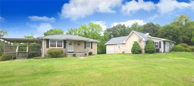 27 Elich Rd, Pa, PA 15021 - view of front facade featuring a front lawn and a deck