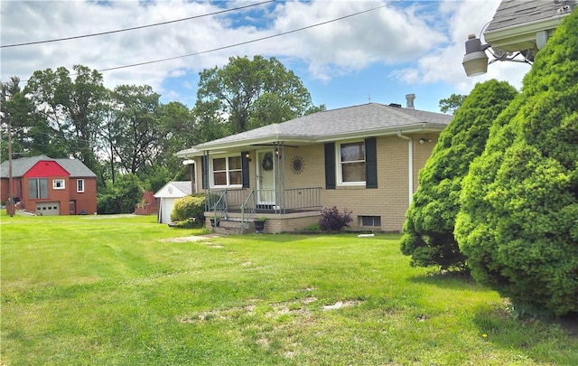 27 Elich Rd, Pa, PA 15021 - bungalow-style home featuring a porch, a front lawn, brick siding, roof with shingles, and a garage