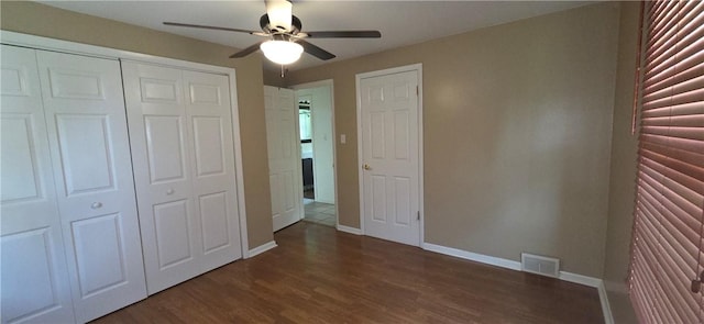 27 Elich Rd, Pa, PA 15021 - unfurnished bedroom with baseboards, dark wood-style floors, a closet, and ceiling fan