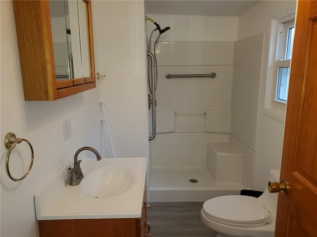 634 5th Ave, Ford City Boro, PA 16226 - full bathroom with a shower stall, toilet, vanity, and wood finished floors