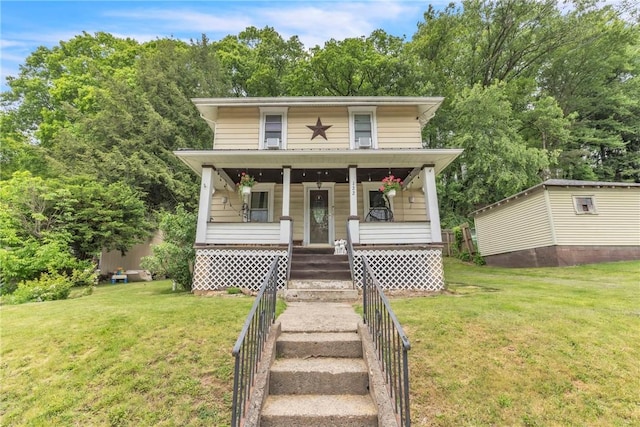 122 W Main St, Worthington, PA 16262 - american foursquare style home with a front yard, a porch, and stairs