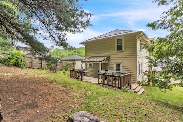 122 W Main St, Worthington, PA 16262 - rear view of property with a wooden deck and metal roof