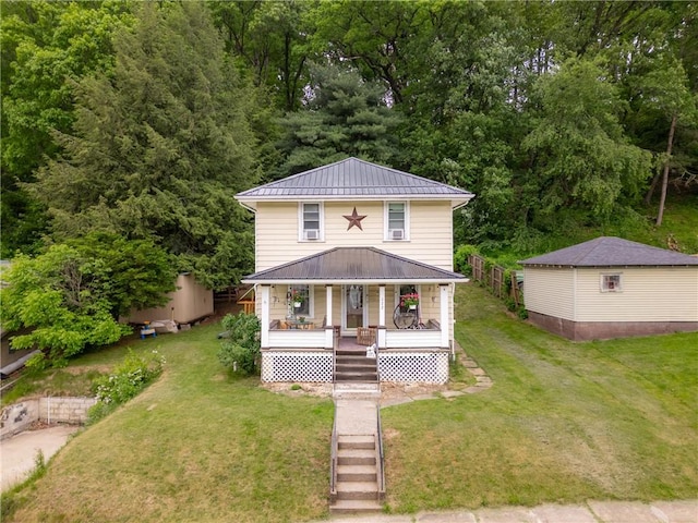 122 W Main St, Worthington, PA 16262 - american foursquare style home with a porch, metal roof, a standing seam roof, and a front lawn